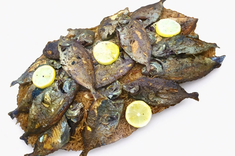Fried Safi Fish with eggplant hamsa and shalani rice Al Lulu Kitchen